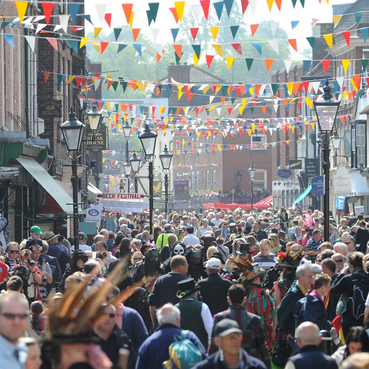 People in rochester high street celebrating sweeps festival